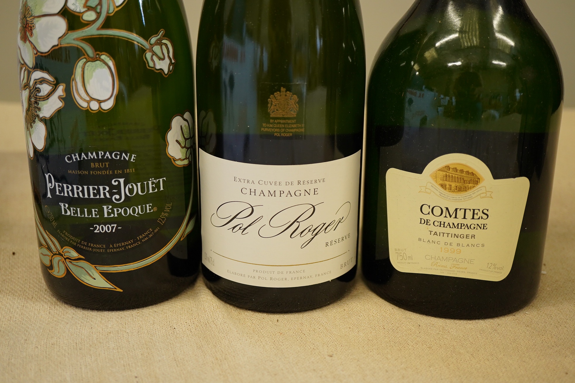 A bottle of 2007 Perrier - Jouet Belle Epoque Champagne, a bottle of Taittinger Comtes Champagne and a bottle of Pol Roger Extra Cuvee Reserve Champagne (3)